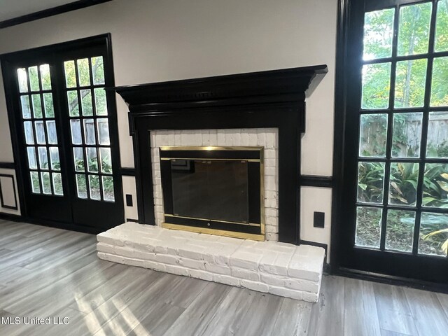 767 Sherwood Dr, Jackson, MS 39216 - detailed view of a brick fireplace and wood finished floors