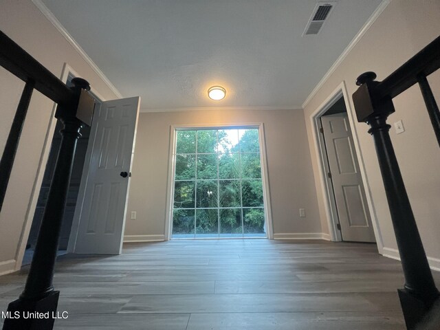 767 Sherwood Dr, Jackson, MS 39216 - unfurnished bedroom with wood finished floors, ornamental molding, and baseboards