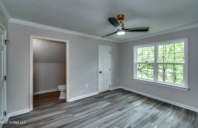 767 Sherwood Dr, Jackson, MS 39216 - unfurnished bedroom with ornamental molding, wood finished floors, baseboards, and a ceiling fan