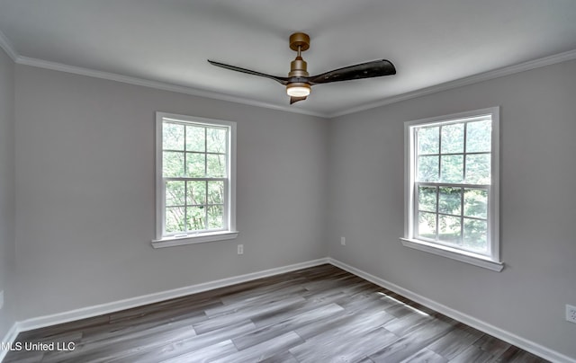 767 Sherwood Dr, Jackson, MS 39216 - unfurnished room featuring healthy amount of natural light, ornamental molding, baseboards, a ceiling fan, and wood finished floors