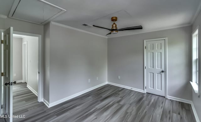 767 Sherwood Dr, Jackson, MS 39216 - unfurnished room featuring attic access, wood finished floors, ornamental molding, ceiling fan, and baseboards