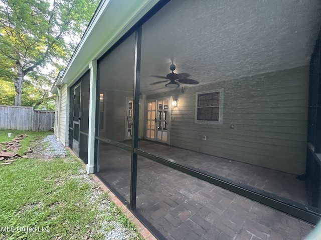 767 Sherwood Dr, Jackson, MS 39216 - view of patio featuring fence, a ceiling fan, and a sunroom