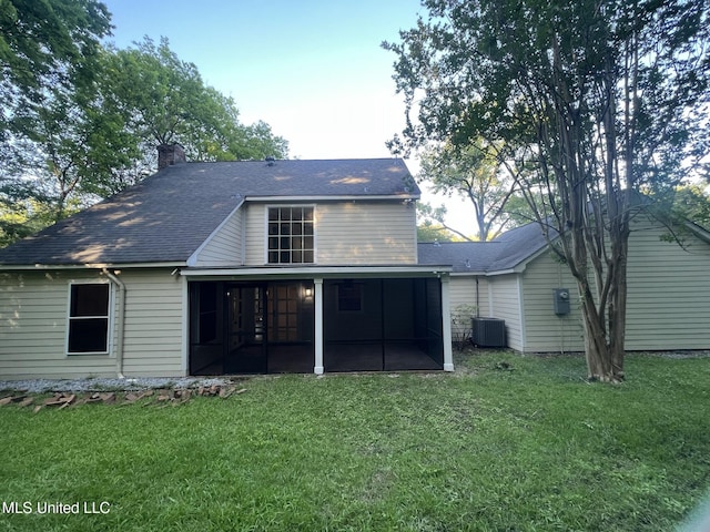767 Sherwood Dr, Jackson, MS 39216 - rear view of property with a sunroom, a lawn, cooling unit, and a chimney