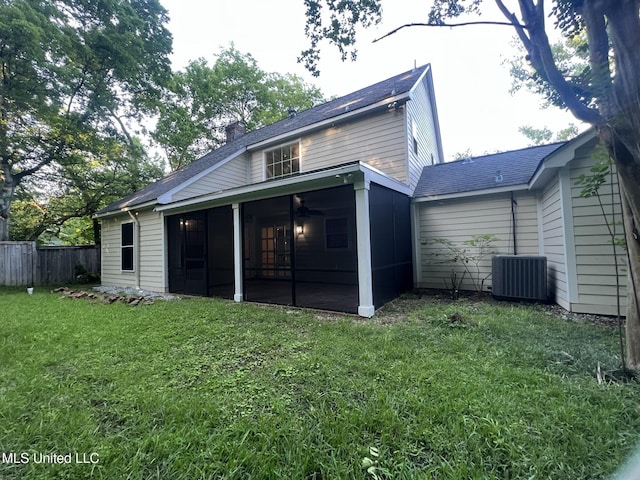767 Sherwood Dr, Jackson, MS 39216 - rear view of house with a sunroom, cooling unit, a chimney, a ceiling fan, and a shingled roof