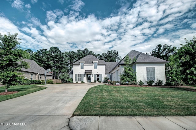 220 S Woodcreek Rd, Madison, MS 39110 - french country style house featuring a front yard and driveway