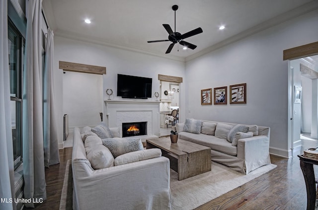 220 S Woodcreek Rd, Madison, MS 39110 - living area with a lit fireplace, a ceiling fan, dark wood-style floors, crown molding, and recessed lighting