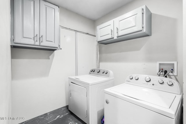 laundry area with cabinets and independent washer and dryer