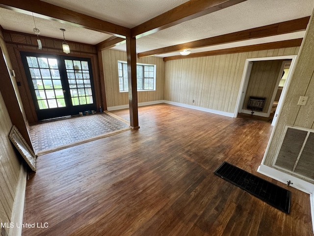 221 N Third Ave, Cleveland, MS 38732 - foyer featuring a textured ceiling, wood finished floors, beamed ceiling, wood walls, and french doors