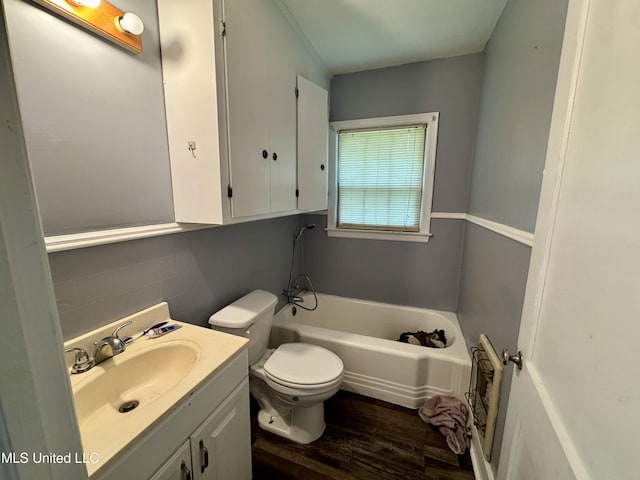 221 N Third Ave, Cleveland, MS 38732 - full bathroom featuring a bath, toilet, wood finished floors, and vanity