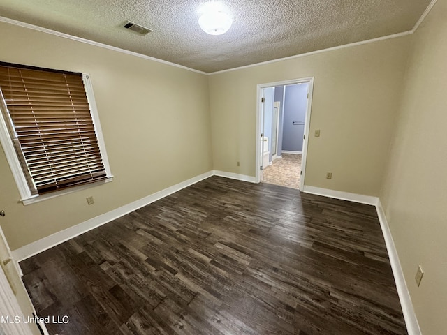 221 N Third Ave, Cleveland, MS 38732 - spare room featuring dark wood-style flooring, a textured ceiling, crown molding, and baseboards