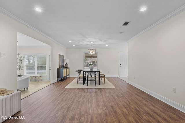 13901 Plano Rd, Ocean Springs, MS 39564 - dining room with crown molding, recessed lighting, wood finished floors, and baseboards