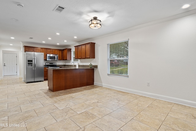 kitchen with sink, kitchen peninsula, crown molding, and appliances with stainless steel finishes