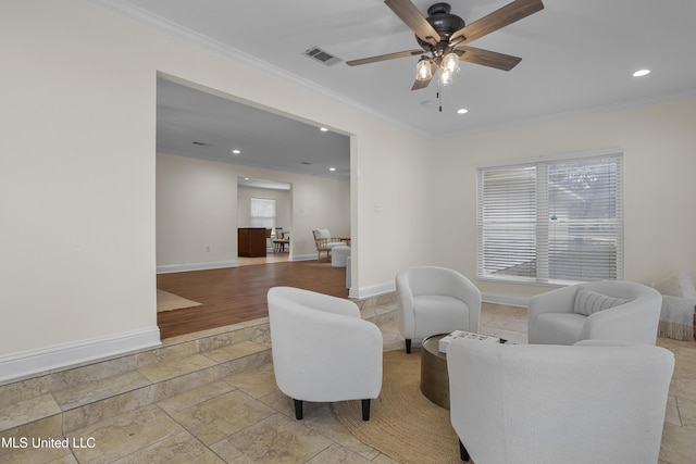 13901 Plano Rd, Ocean Springs, MS 39564 - living area with crown molding, stone tile floors, recessed lighting, ceiling fan, and baseboards