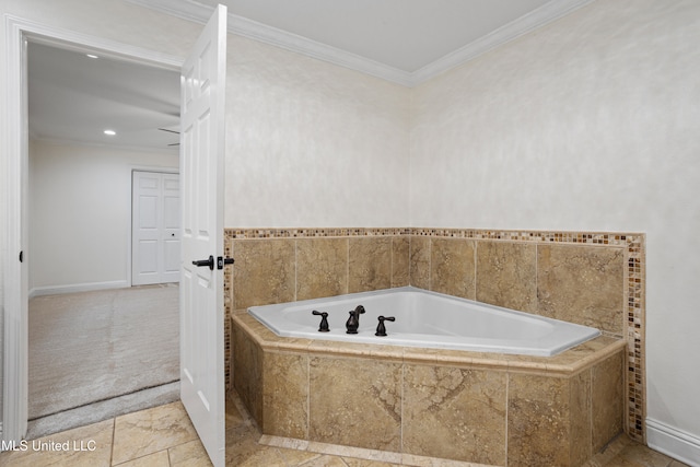 bathroom featuring crown molding and tiled tub