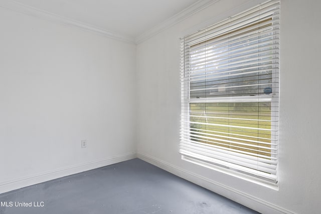 unfurnished room featuring plenty of natural light and ornamental molding