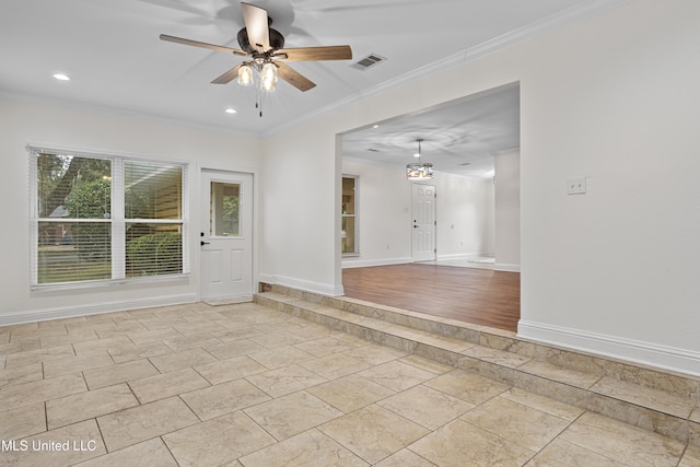 unfurnished room featuring light hardwood / wood-style floors, ceiling fan, and crown molding