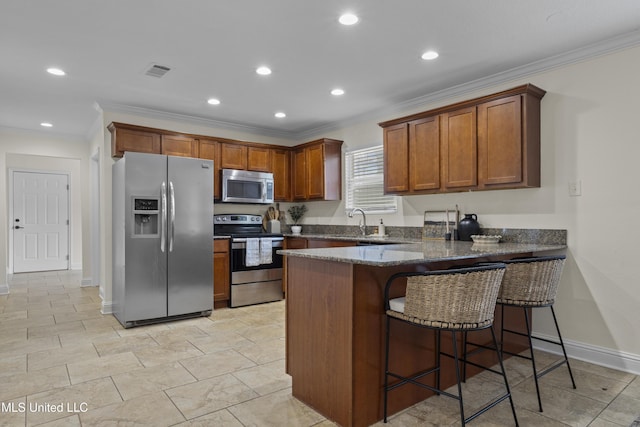 13901 Plano Rd, Ocean Springs, MS 39564 - kitchen featuring stainless steel appliances, a peninsula, dark stone counters, crown molding, and brown cabinetry