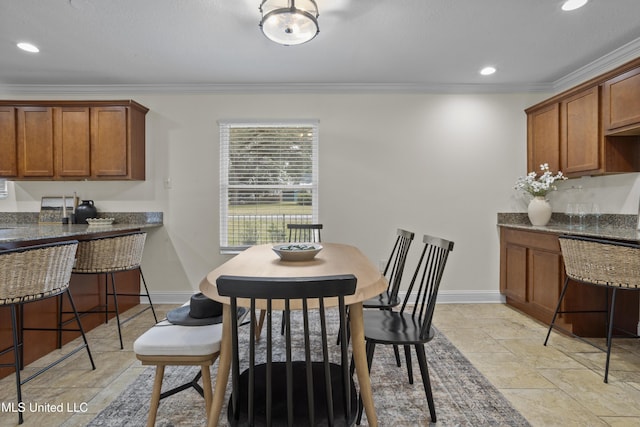 dining space featuring recessed lighting, baseboards, and ornamental molding