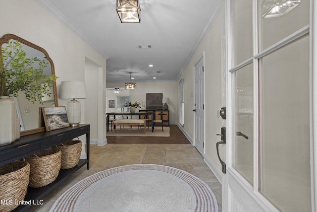 13901 Plano Rd, Ocean Springs, MS 39564 - foyer entrance with crown molding, recessed lighting, light tile patterned floors, and baseboards
