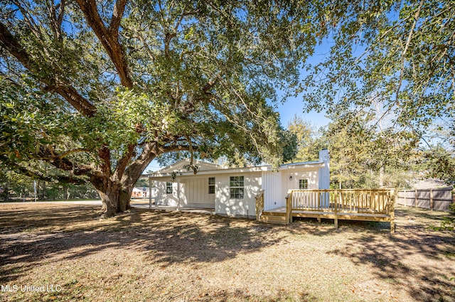 rear view of property with a deck