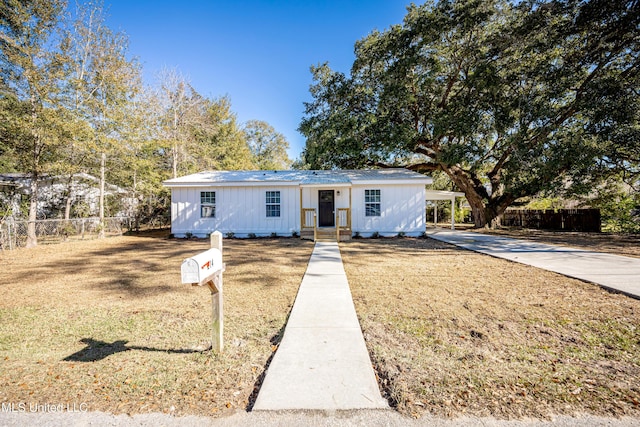 view of front of property with a carport