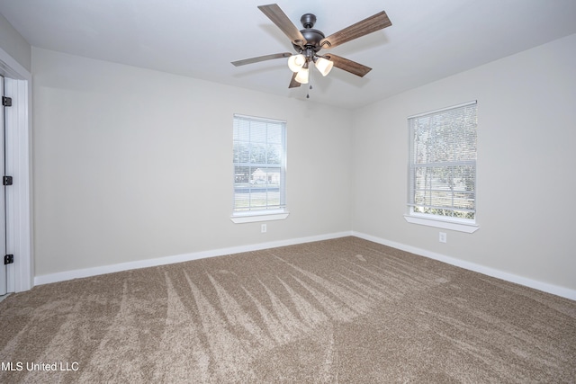 carpeted empty room with ceiling fan