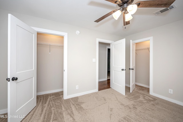 unfurnished bedroom with carpet flooring and ceiling fan