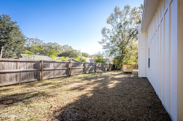 view of yard featuring a wooden deck