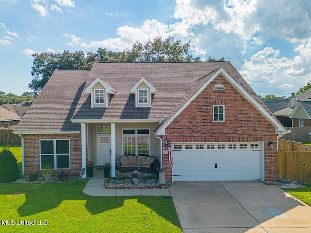 view of front of house featuring a garage and a front yard