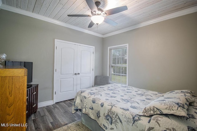 bedroom with wood ceiling, ornamental molding, dark hardwood / wood-style flooring, a closet, and ceiling fan