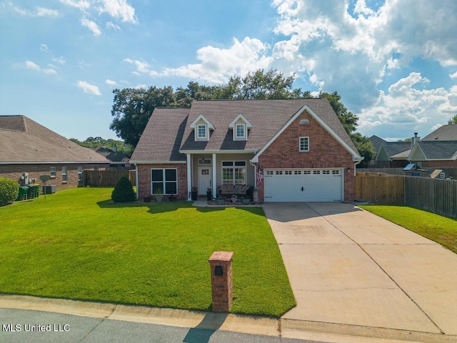 view of front facade with a porch, a garage, and a front yard