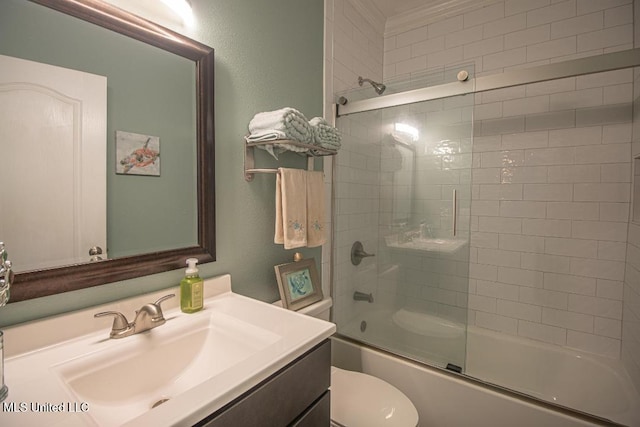 full bathroom featuring enclosed tub / shower combo, vanity, and toilet