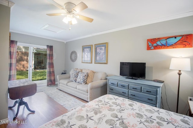 bedroom featuring light hardwood / wood-style flooring, ornamental molding, ceiling fan, and access to outside