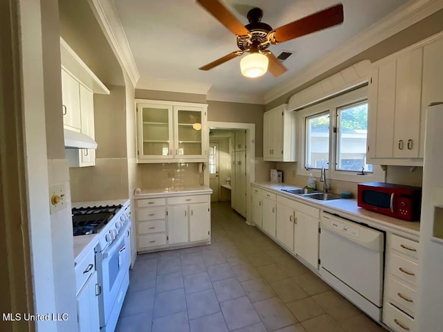 kitchen featuring white cabinets, white appliances, crown molding, and sink