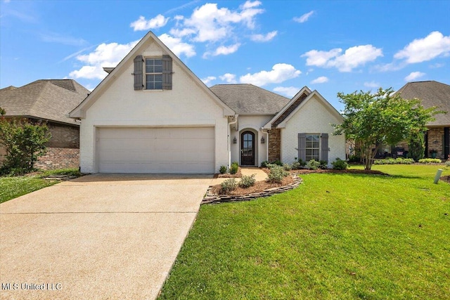 311 Emerald Way, Brandon, MS 39047 - view of front of property featuring concrete driveway, a front lawn, and brick siding