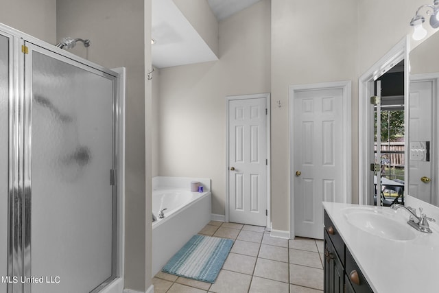 bathroom with vanity, independent shower and bath, and tile patterned flooring