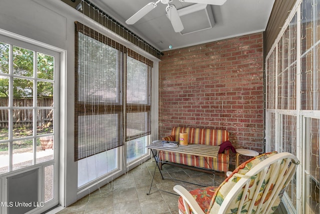 sunroom with ceiling fan