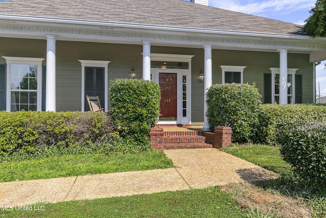 doorway to property featuring covered porch