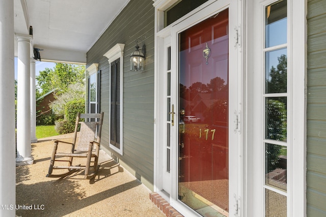 doorway to property featuring covered porch