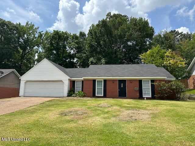 1613 Springridge Dr, Jackson, MS 39211 - single story home with a garage, a front yard, and concrete driveway
