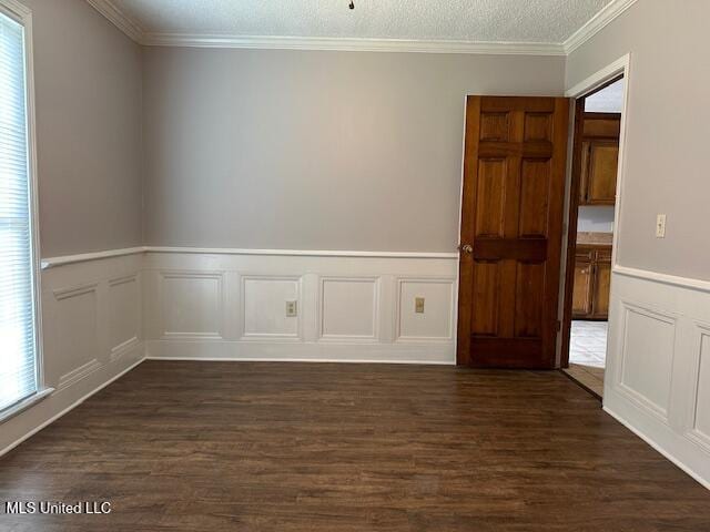 1613 Springridge Dr, Jackson, MS 39211 - unfurnished room featuring dark wood finished floors, a wainscoted wall, crown molding, and a decorative wall