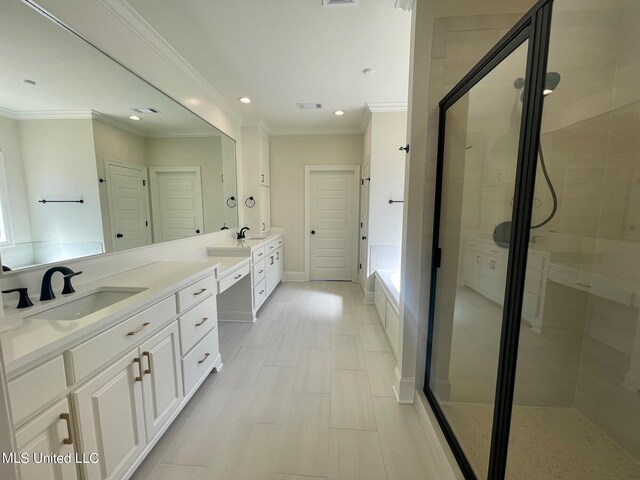 bathroom featuring vanity, independent shower and bath, ornamental molding, and tile patterned flooring