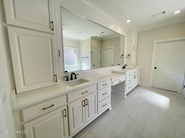 bathroom featuring vanity and crown molding