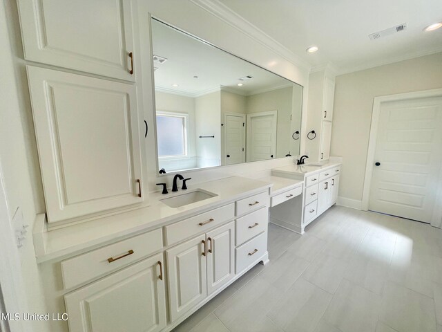 bathroom featuring vanity and crown molding