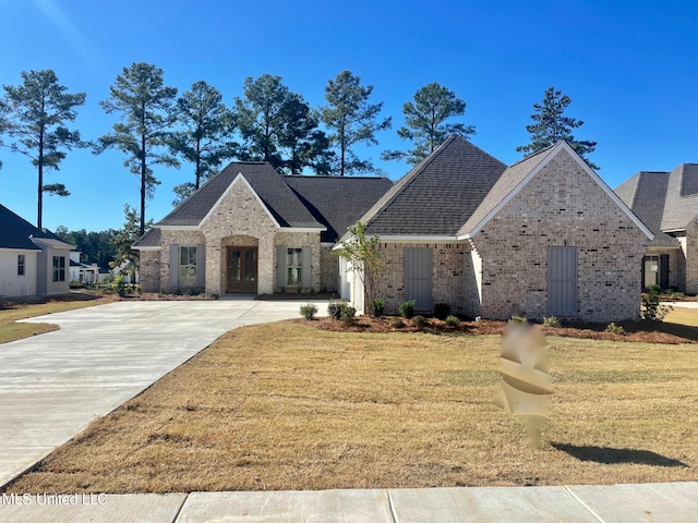 view of front of home with a front yard