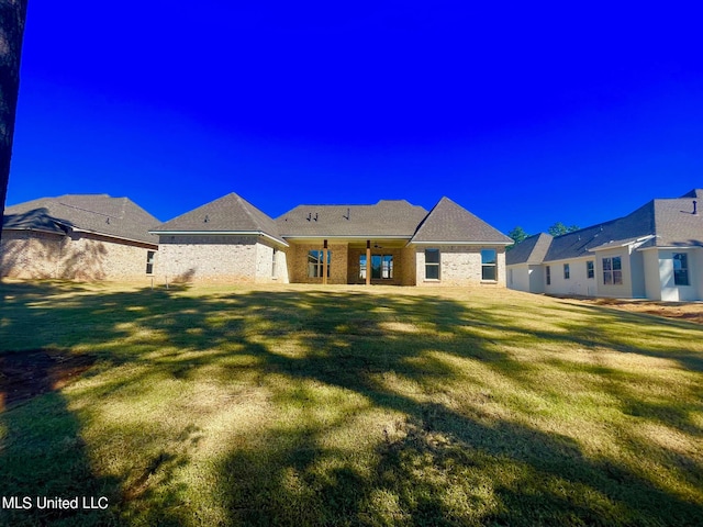352 Wellstone Pl, Madison, MS 39110 - rear view of property with a lawn and brick siding