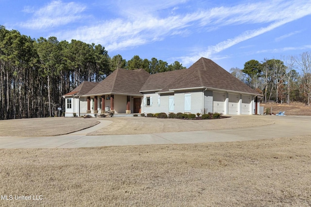 view of front of property featuring a porch and a garage