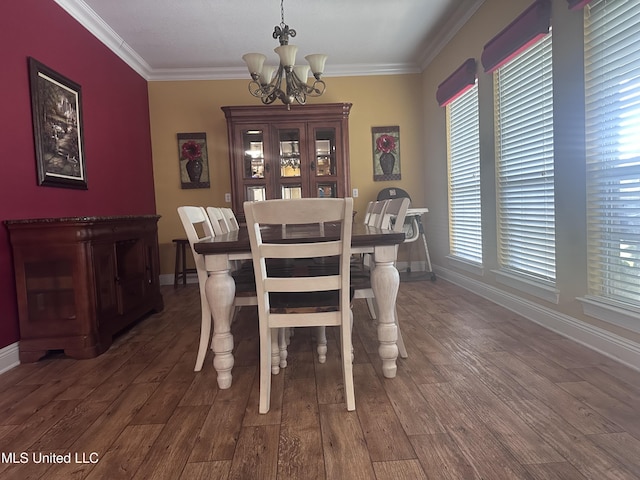 8101 Pecan Ridge Dr, Moss Point, MS 39562 - dining space with a chandelier, crown molding, and wood finished floors