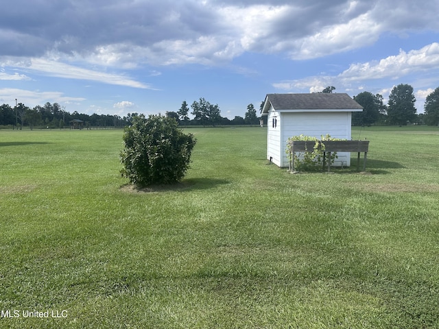8101 Pecan Ridge Dr, Moss Point, MS 39562 - view of grassy yard with a storage shed