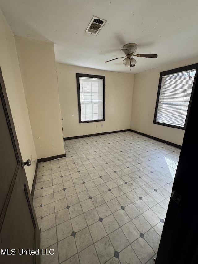 spare room with ceiling fan